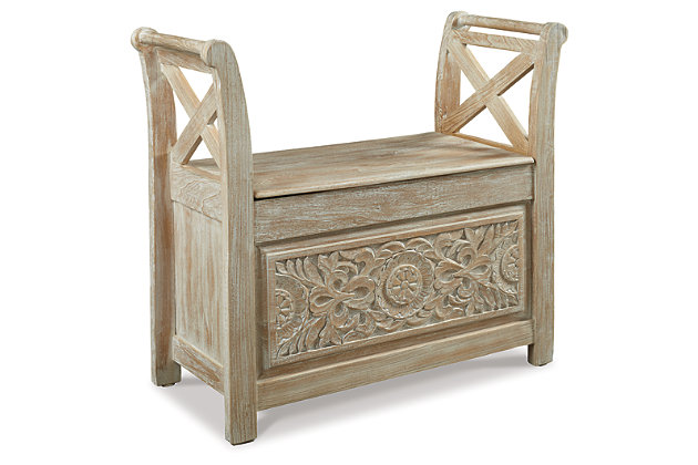 Get a dose of bohemian bliss with the Fossil Ridge accent bench. Whitewashed wood finish fits in effortlessly with your existing decor. Carved floral pattern beautifully covers the bottom front as X-design arms entice from above. Ready for more? Lift the seat for plenty of storage action underneath.Made of solid wood and engineered wood | Whitewashed finish | Hinged seat with storage underneath | Estimated Assembly Time: 15 Minutes