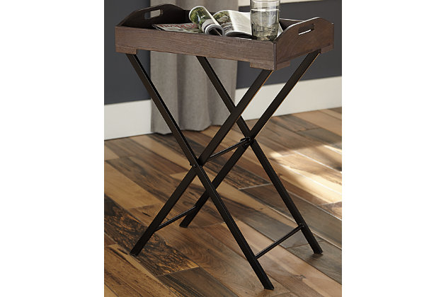 Bring your food to you with the modern farmhouse Cadocridge accent table. Removable wooden tray holds your food and beverages wherever you are. Antique gray finish of the wood embraces the beauty of natural elements. You’ll love the ease of folding the black finished metal base to put away when you’re done.Made of wood and metal | Removable tray | Foldable base | Estimated Assembly Time: 15 Minutes