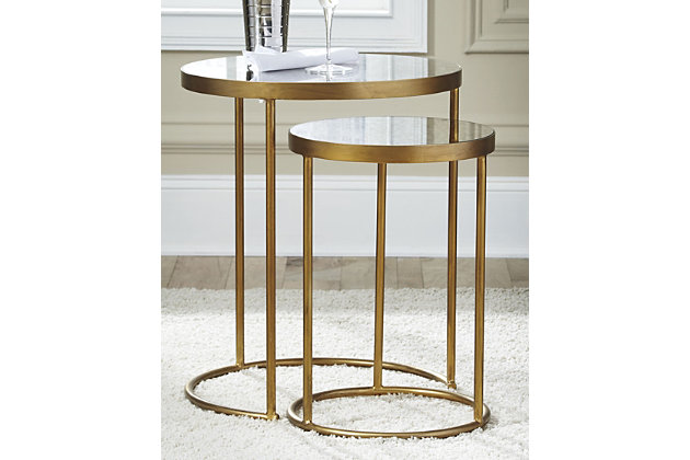 Make your nest that much more luxurious with this pair of Majaci nesting tables. Antiqued mirrored glass is a rich complement to luminous goldtone finished metal.Made of goldtone metal | Mirrored glass tabletops | Clean with a soft, dry cloth | Estimated Assembly Time: 30 Minutes