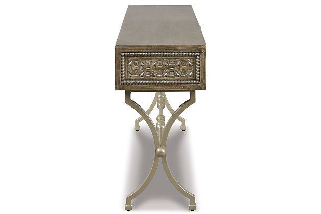 The Quinnland console sofa table is style with a purpose. This casual look flaunts a medallion pattern along the front. Champagne color finished metal complements the antiqued gray finished wood. Show off decor on top. Rest assured X-base is as strong as it looks. Functional drawer allows you to keep knick-knacks out of sight.Made of solid wood | Champagne color finished metal | 1 drawer | Estimated Assembly Time: 30 Minutes