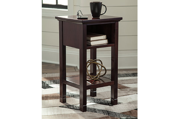 Your home called. It asked for the Marnville accent table. Cherry brown finish is simply irresistible, elevating the silhouette with elegance. Clean lines maintain the contemporary aesthetic you crave. Open cubby and bottom shelf provide storage for essentials and decor. Power up your devices with USB ports. How’s that for form and function?Made of wood, engineered wood and veneers | Cherry brown finish | 1 open cubby and bottom shelf | 2 USB charging ports | Power cord included; UL Listed | Estimated Assembly Time: 15 Minutes