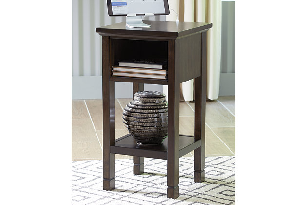 Your home called. It asked for the Marnville accent table. Dark brown finish is simply irresistible, elevating the silhouette with elegance. Clean lines maintain the contemporary aesthetic you crave. Open cubby and bottom shelf provide storage for essentials and decor. Power up your devices with USB ports. How’s that for form and function?Made of wood, engineered wood and veneers | Dark brown finish | 1 open cubby and bottom shelf | 2 USB charging ports | Power cord included; UL Listed | Estimated Assembly Time: 15 Minutes