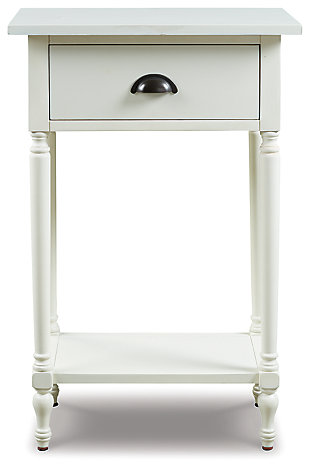 The perfect complement to any sofa, the Juinville accent table embodies quintessential vintage charm. It’s casually cool with a bronze-tone cupped drawer pull, turned legs, a framed drawer front and a classic white finish. You’ll love how the convenient drawer stores remotes and catchalls with ease. Last, but certainly not least, the bottom shelf is a hot spot for decor accents or an extra bin for tip-top organization in spaces.Made of veneers, wood and engineered wood | White finish | 1 smooth-gliding drawer, 1 lower shelf | Antique bronze-tone finished metal drawer pull | Assembly required | Estimated Assembly Time: 15 Minutes