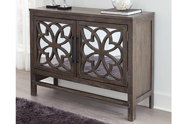 Short on storage? Fret not. The Alvaton accent cabinet with distinctive fretwork has you covered. Mirrored inlays on the double cabinet doors lend an open and airy feel, while an adjustable shelf nicely accommodates. What a versatile piece that works beautifully in an entryway, dining room, kitchen or great room.Made of wood and veneer | Antique brown finish | Silvertone finished metal door pulls | Fretwork over mirrored door fronts | 2 cabinet doors | 1 adjustable shelf | Assembly required | Estimated Assembly Time: 30 Minutes