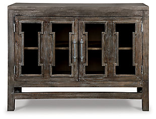 With its clean, contemporary styling and antique finish, the Hanimont accent cabinet turns storage into an art form. Cutout pattern on the glass panel door fronts provides a lovely peekaboo effect. Be it in the entryway, dining room or living room, what a welcome addition.Made of wood and veneer | Antique brown finish | Silvertone finished metal door pulls | Door fronts with clear glass cutouts | 2 cabinet doors | Fixed shelf | Assembly required | Estimated Assembly Time: 45 Minutes