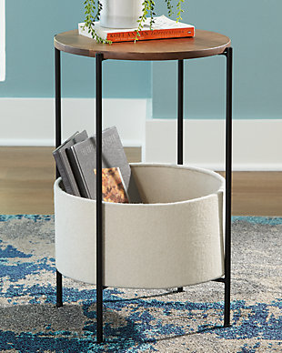 The casual display and storage solution you've been looking for, this Brookway accent table is the perfect finishing touch for any room. Wood with a medium brown finish adds warmth, while the black finished metal keeps things sleek and simple. With the included cream felt storage basket, you can keep clutter controlled.Made of solid wood in medium brown finish | metal base in black | Felt basket in cream for storage | Minimal assembly required | Estimated Assembly Time: 15 Minutes