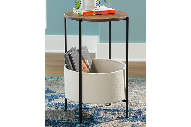 The casual display and storage solution you've been looking for, this Brookway accent table is the perfect finishing touch for any room. Wood with a medium brown finish adds warmth, while the black finished metal keeps things sleek and simple. With the included cream felt storage basket, you can keep clutter controlled.Made of solid wood in medium brown finish | metal base in black | Felt basket in cream for storage | Minimal assembly required | Estimated Assembly Time: 15 Minutes