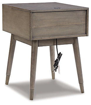 A study in seeming contradictions, the Paulrich accent table is both practical and stylish. A storage drawer lets you keep necessary items in reach while out of sight, and two USB ports keep your devices powered up as you wind down. The clean lines and antique gray finish give this piece a high-design profile to elevate your space.Made of veneer, solid and engineered woods | Antiqued gray finish | Pewter-tone hardware | 1 drawer | 2 USB charging ports | Assembly required | Estimated Assembly Time: 15 Minutes
