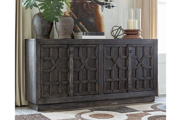 Whether you decide to use it as dining room storage or a living room TV stand, your love of unique style will shine front and center with the Roseworth accent cabinet. The 4 distressed patterned door fronts finished in black and 2 fixed shelves add stylish versatility filled with possibilities.Solid and engineered wood | Distressed black finish | 4 doors | 2 fixed shelves | Cord openings in back | Assembly required | Estimated Assembly Time: 60 Minutes