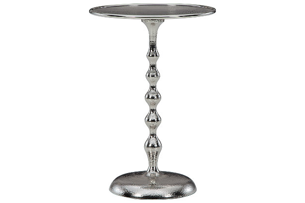 The Chaseton accent table brings understated elegance to any space. The round side table has a classic shape that’s perfect next to a roll-arm sofa or sleek track-arm chair. It’s crafted entirely of metal and sealed with a lustrous plated silvertone finish with hammered pattern accent.Aluminum | Plated silvertone finish | Assembly required | Estimated Assembly Time: 15 Minutes