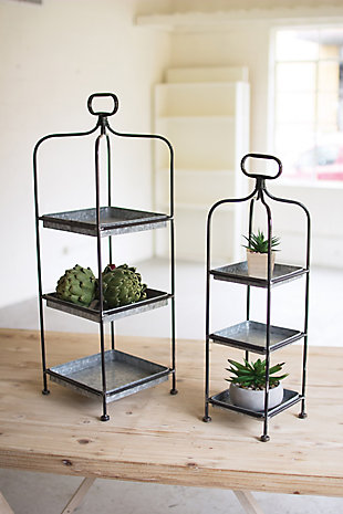 Elevate the everyday with this pair of 3-tier stands. Removable trays fit neatly in the metal frame ready to hold a collection of seashells or succulents. Time to entertain? Rest easy—handy handles make moving them a breeze. Fill with scrumptious sweets or a selection of cheeses. The possibilities are endless.Set of 2; 1 large and 1 medium stand | Each stand has 3 galvanized metal removable trays | Stands with brown finish