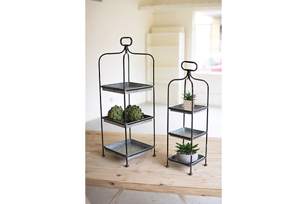 Elevate the everyday with this pair of 3-tier stands. Removable trays fit neatly in the metal frame ready to hold a collection of seashells or succulents. Time to entertain? Rest easy—handy handles make moving them a breeze. Fill with scrumptious sweets or a selection of cheeses. The possibilities are endless.Set of 2; 1 large and 1 medium stand | Each stand has 3 galvanized metal removable trays | Stands with brown finish