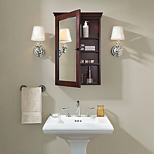 Not quite ready for the inconvenience and expense of a complete bathroom remodel? This line of stylish storage solutions will help you create the bathroom of your dreams.  the high-end design of this wall medicine cabinet keeps your bathroom essentials and its true purpose cleverly under wraps. The mirrored cabinet door opens to reveal roomy storage space and three adjustable shelves. Its dual-purpose role as a mirror and cabinet allows you to live large in small spaces.Made of wood, veneers and engineered wood | Steel-tone metal accents | Mirrored door | Spacious storage space behind door with 4 shelves | Ready to mount on wall | Assembly required