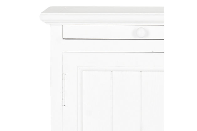 A quaint—and practical—accompaniment to country cottage and modern farmhouse interiors, this storage cabinet in crisp white is loaded with possibilities, from the family room to the guest bath. Charming beadboard-style cabinet reveals ample stowaway space. Open cubby makes whatnots so accessible, while pullout tray extends your surface space for everything from makeup to snacks and remote controls.Made of wood | White finish | Cabinet storage with shelf | Open cubby | Pull-out tray | No assembly required