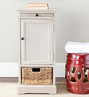 A quaint—and practical—accompaniment to country cottage and modern farmhouse interiors, this storage cabinet in vintage gray is loaded with possibilities, from the family room to the guest bath. Roomy cabinet with shelving reveals ample stowaway space. Open cubby with rattan basket makes whatnots so accessible, while pullout tray extends your surface space for everything from makeup to snacks and remote controls.Made of wood | Vintage gray finish | Cabinet storage with shelf | Open cubby | Pull-out tray | Woven rattan storage basket | No assembly required
