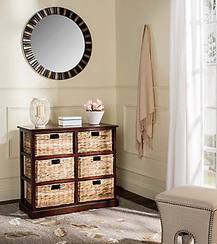 Getting a little short on storage space? Look no further than this perfectly charming—and practical—6-basket storage shelf. The ideal way to organize any room in the house, six spacious woven baskets tuck neatly into a rugged red pine cabinet. As versatile as it is attractive, use it in place of a dresser, sideboard or TV stand for that much more cool character.Made of pine | Vintage cherry finish | 6 open cubbies | 6 woven rattan storage baskets with cutout handles | No assembly required