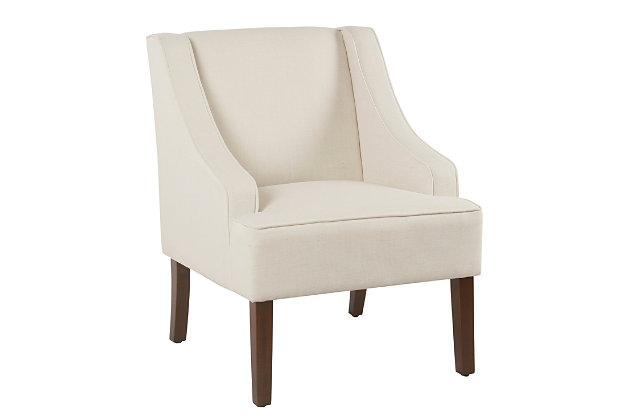 The graceful swoop-arm styling of this accent chair sets the tone for all proclaimed casually cool spaces. A rich wood finish, designer fabric and welted cushions perfect the laid-back vibe.Made of wood and engineered wood | Attached cushions | Medium firm foam and sinuous spring cushions | Woven textured cream fabric upholstery | Welted seams | Exposed legs with walnut finish | Assembly required