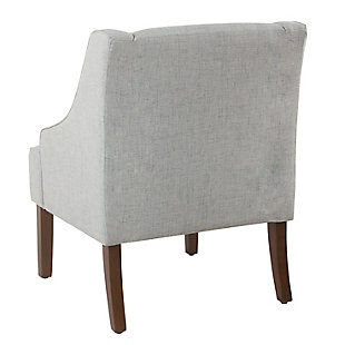 The graceful swoop-arm styling of this accent chair sets the tone for all proclaimed casually cool spaces. A rich wood finish, designer fabric and welted cushions perfect the laid-back vibe.Made of wood and engineered wood | Attached cushions | Medium firm foam and sinuous spring cushions | Woven textured light blue upholstery | Welted seams | Exposed legs with walnut finish | Assembly required