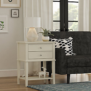 Whether flanking a sofa or chair or serving as a dreamy nightstand, this accent table in white is loaded with charm and potential. Sure to look right at home in modern farmhouse and cottage chic settings, this accent table with two drawers and a display shelf is compact yet accommodating.Made of wood and engineered wood | 2 drawers | Fixed shelf | Assembly required | Small space solution