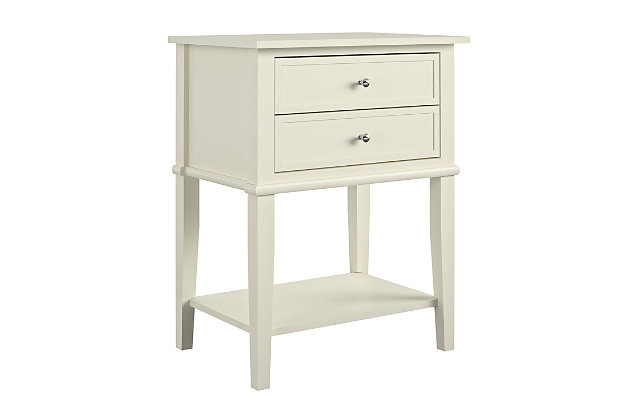 Whether flan a sofa or chair or serving as a dreamy nightstand, this accent table in white is loaded with charm and potential. Sure to look right at home in modern farmhouse and cottage chic settings, this accent table with two drawers and a display shelf is compact yet accommodating.Made of wood and engineered wood | 2 drawers | Fixed shelf | Assembly required |  space solution