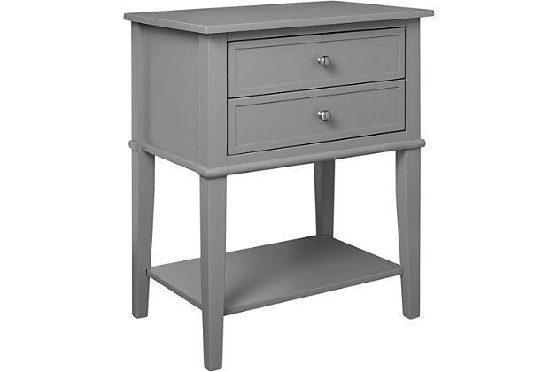 Whether flanking a sofa or chair or serving as a dreamy nightstand, this accent table in gray is loaded with charm and potential. Sure to look right at home in modern farmhouse and cottage chic settings, this accent table with two drawers and a display shelf is compact yet accommodating.Made of wood and engineered wood | 2 drawers | Fixed shelf | Assembly required