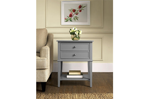 Whether flanking a sofa or chair or serving as a dreamy nightstand, this accent table in gray is loaded with charm and potential. Sure to look right at home in modern farmhouse and cottage chic settings, this accent table with two drawers and a display shelf is compact yet accommodating.Made of wood and engineered wood | 2 drawers | Fixed shelf | Assembly required