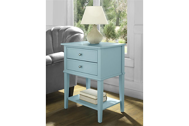 Whether flanking a sofa or chair or serving as a dreamy nightstand, this accent table in blue is loaded with charm and potential. Sure to look right at home in modern farmhouse and cottage chic settings, this accent table with two drawers and a display shelf is compact yet accommodating.Made of wood and engineered wood | 2 drawers | Fixed shelf | Assembly required