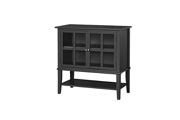 Master the art of organization in an entryway, main living area or home office with this highly versatile 2-door storage cabinet in black. Glass-front double doors with mullion frame reveal a roomy storage cabinet with adjustable shelving. Lower shelf makes this compact piece that much more accommodating.Made of wood and engineered wood | 2 doors with glass panels | Adjustable door hinges | Adjustable cabinet shelf; fixed lower shelf | Assembly required