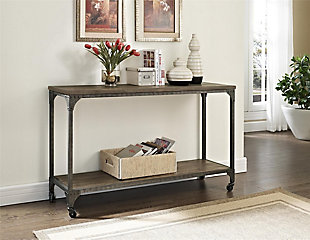 Roll out rustic industrial flair with this ultra-cool console table. Whether serving as a sofa table or taking center stage in the entryway, this accent table with locking casters offers so much versatility. Be it in a modern farmhouse or urban loft, this designer table with weathered charm simply says welcome home.Made of metal and wood veneer | Distressed finish | Tabletop and shelf with plank effect | Locking casters included | Assembly required