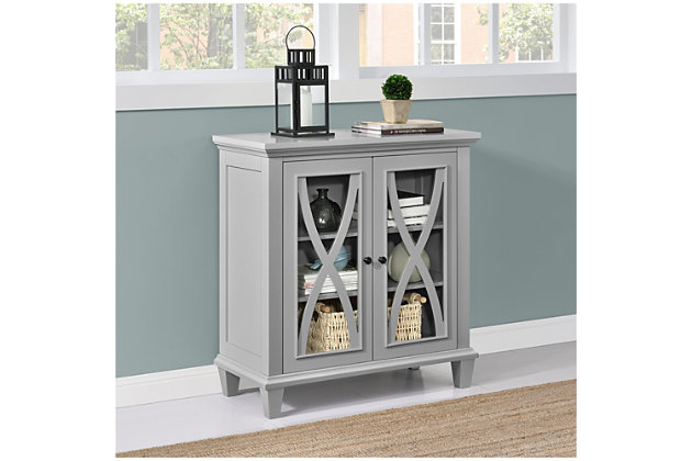 Say hello to style and goodbye to clutter with this simply elegant accent cabinet in gray. Loaded with versatility, this 2-door storage cabinet with trio-level storage is dressed to impress with decorative mouldings and glass-front double doors with curved X overlays. What a striking way to master the art of organization.Made of engineered wood | 2 doors with glass panels | 2 shelves (3 levels) of storage | Black knobs | Assembly required