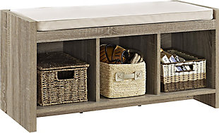 Take a seat—anywhere you like—with this stylish and versatile storage bench. An ideal addition to your entryway or mudroom, it’s also equally welcome at the foot of the bed. Three open cubbies provide plenty of options for storage. Wrapped in a light beige fabric, the thickly padded seat caters to your comfort.Made of engineered wood | Distressed light brown finish | 3 cubbies | Foam cushioned seat | Beige polyester upholstery | Assembly required