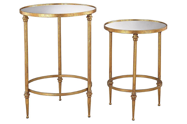 Take a stance for clearly contemporary style. Combining a circular glass top and a rich goldtone base, this accent table set lets modern minimalism take shape. Gentle curves and crisp, clean lines work beautifully together.Set of 2 | Made of metal and glass | Mirrored glass inserts | Goldtone frame | Assembly required