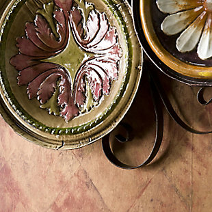 "Absolutely stunning" is all that your guests will be able to say after seeing this beautiful Italian plate wall art brimming with color. Assorted sizes and patterns are created from decorative metal plates. then hand-painted and glazed. The assortment is further enhanced by a decorative scroll frame that holds the plates together. Add a Tuscan vibe to your home today.Made of powdercoated iron | Multi-colored floral designs | Hand-painted | Ready to hang | No assembly required