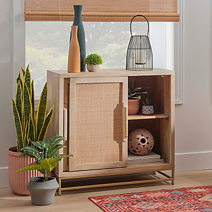 Simple and geometric, this sliding door cabinet offers versatile function without sacrificing distinctive style. The cabinet’s real wood caning and gleaming goldtone metal frame anchor your room with strong architectural lines. Blending elements from colonial and urban industrial decor, this cabinet complements any home or office in both form and function.Made of mango wood, wood cane rattan and metal | Natural finish | Goldtone metal base | Sliding door cabinet with 1 fixed shelf | No assembly required