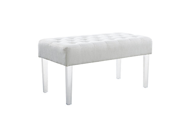Exuding modern design and appeal, this bench features acrylic legs and is ideal for adding eye-catching style to any space. The clear acrylic legs offer a dramatic look to the simple shape. The plush seat is upholstered in a linen weave fabric with silver lurex threads and simple tufted details. Perfect for placing in a bedroom, dressing area or living space.Acrylic, fabric and foam | White linen upholstery | Tufted seat | Clear acrylic legs | Assembly required