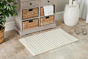 Turn any bathroom into a spa with this ultra-luxurious, extra dense, channel stripe bath rug. Featuring a sophisticated design loomed by hand, in combinations of high and low loops, for subtle tone-on-tone patterns. This bath mat contains a generous 2400 grams of cotton per square meter for luxurious softness underfoot and is backed with latex to prevent slipping.Set of 2 | 100% cotton | Natural | Non-slip latex backing | Machine wash | Imported