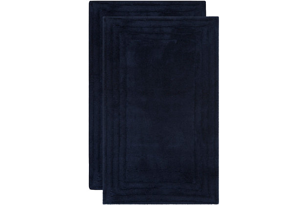 Add a lavish spa feel to the bath with the soft, fabulously functional, luxe stripe bath mat. Made using an indulgent blend of cotton for luxurious softness underfoot and a durable latex backing to prevent slipping.Set of 2 | 100% cotton | Navy | Non-slip latex backing | Machine wash | Imported