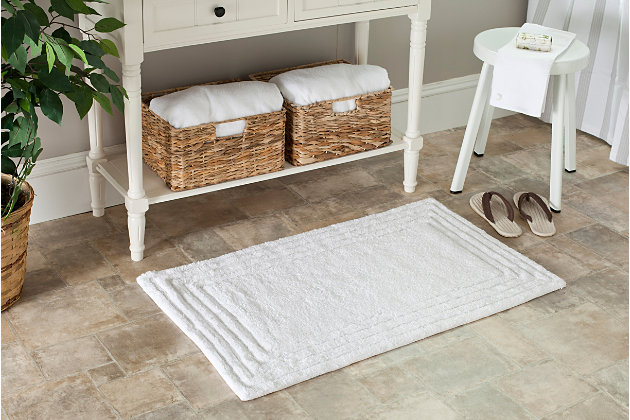 Add a lavish spa feel to the bath with the soft, fabulously functional, luxe stripe bath mat. Made using an indulgent blend of cotton for luxurious softness underfoot and a durable latex backing to prevent slipping.Set of 2 | 100% cotton | White | Non-slip latex backing | Machine wash | Imported
