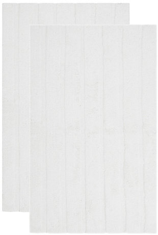 Add a lavish spa feel to the bath with this soft, fabulously functional, striped hand-tufted bath mat. Indulge in the luxury of plush and absorbent cotton every time you step on this reversible bath mat. One side is ribbed in elegantly simple vertical bands, while the other side is solid texture, all crafted from a deluxe 3000 grams of pure cotton.Set of 2 | 100% fine Indian cotton | Hand-tufted | White | Reversible (no backing) | Rug pad recommended to avoid shifting and sliding | Imported
