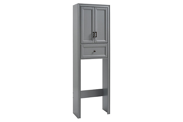 Bring a sense of order to your bathroom with this chic shelved tower. Designed to add much-needed bathroom storage, its roomy cabinet and drawer provide an elegant use of space. At home in the tightest or most spacious bath, its compact footprint allows you to live in places.Pine frame with birch veneer | Gray finish | Metal hardware with distressed brass-tone finish | Double door cabinet with shelf | -extension drawer | Space-saver design fits over most standard toilets | Assembly required