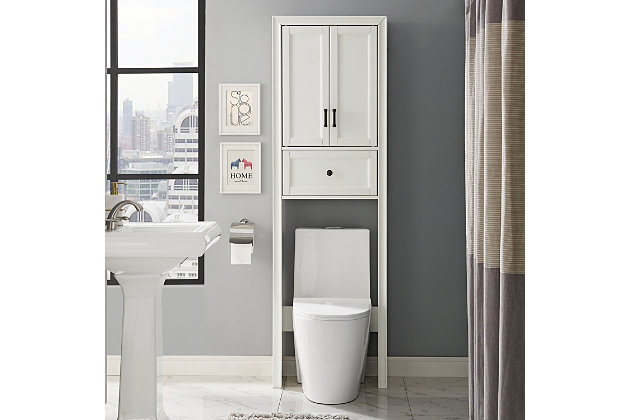 Bring a sense of order to your bathroom with this chic shelved tower. Designed to add much-needed bathroom storage, its roomy cabinet and drawer provide an elegant use of space. At home in the tightest or most spacious bath, its compact footprint allows you to live large in small places.Pine frame with birch veneer | White finish | Metal hardware with distressed brass-tone finish | Double door cabinet with shelf | Full-extension drawer | Space-saver design fits over most standard toilets | Assembly required