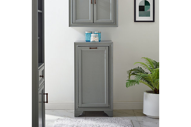 Bring a sense of order to your bathroom with this chic laundry hamper. Designed to add appeal while hiding its true function, its cottage styling and removable laundry bags provide an elegant use of space. At home in the tightest or most spacious bath, its compact footprint allows you to live large in small places.Pine frame with birch veneer | Gray finish | Metal hardware with distressed brass-tone finish | 2 removable cloth bags | Assembly required