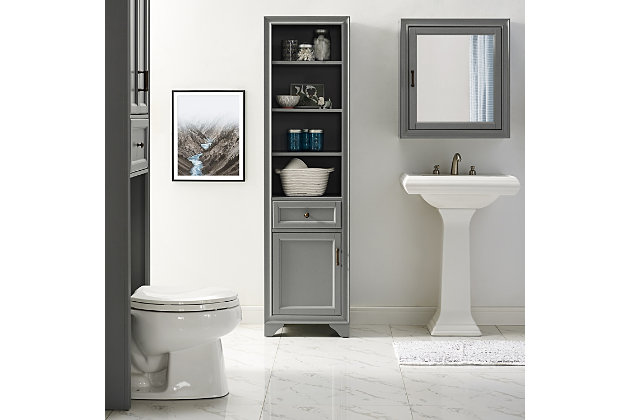 Bring a sense of order to your bathroom with this chic linen cabinet. Designed to add much-needed bathroom storage, its tiered shelves, -extension drawer and roomy cabinet provide an elegant use of space. At home in the tightest or most spacious bath, its compact footprint allows you to live in places.Pine frame with birch veneer | Gray finish | Metal hardware with distressed brass-tone finish | 3 shelves | -extension drawer | Roomy cabinet space | Assembly required