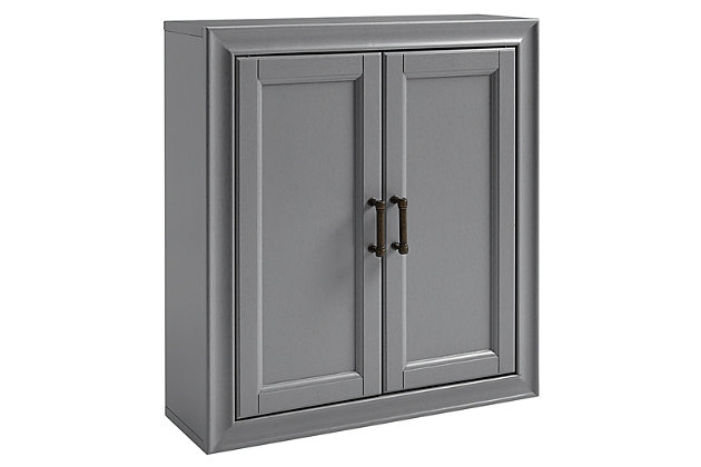 Bring a sense of order to your bathroom with this chic wall cabinet. Designed to add much-needed bathroom storage, its craftsman style doors and roomy cabinet provide an elegant use of space. At home in the tightest or most spacious bath, its compact size allows you to live large in small places.Pine frame with birch veneer | Gray finish | Metal hardware with distressed brass-tone finish | Double door cabinet space | Ready to hang | Assembly required