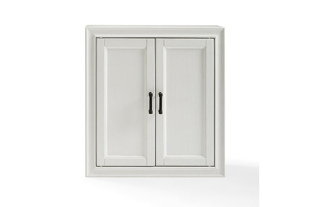 Bring a sense of order to your bathroom with this chic wall cabinet. Designed to add much-needed bathroom storage, its craftsman style doors and roomy cabinet provide an elegant use of space. At home in the tightest or most spacious bath, its compact size allows you to live large in small places.Pine frame with birch veneer | White finish | Metal hardware with distressed brass-tone finish | Double door cabinet space | Ready to hang | Assembly required