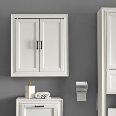White wall cabinet installed above a bathroom vanity with accessories