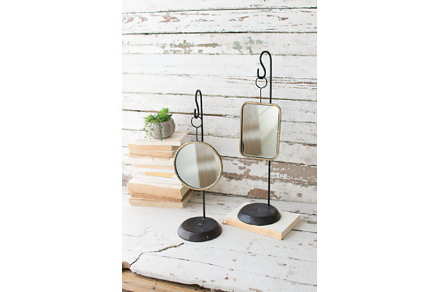 This set of hanging mirrors is perfect as a dressing table accent or extra styling for an entry or side table or even bookcases. The goldtone frame with black iron hanger gives the mirrors a delicate, yet updated feel. Use them together or separate throughout your home.Set of 2 | Metal and mirrored glass | Mirror with antiqued goldtone finish | Hanger with black finish | No assembly required