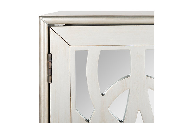 Inspired by the grace of Old Hollywood, this 2-door chest is a design classic. Its overlapping pattern and frame feature a luxurious silver finish that reflects the radiant shimmer of its mirror panels. Designers love its solid wood construction.Paint, rubberwood, miirror | Assembly required | Shelf dimensions: 31.1" x 13.8" x 10.5"