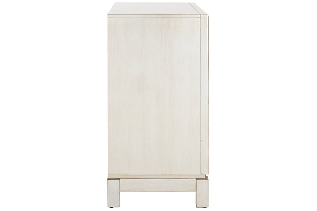 Inspired by the grace of Old Hollywood, this 2-door chest is a design classic. Its overlapping pattern and frame feature a luxurious silver finish that reflects the radiant shimmer of its mirror panels. Designers love its solid wood construction.Paint, rubberwood, miirror | Assembly required | Shelf dimensions: 31.1" x 13.8" x 10.5"