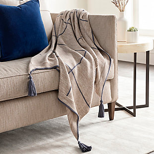 That's a wrap. With its sense of snuggly softness and posh palette, this designer cotton throw blanket is truly irresistible. Flirty fringe takes the aesthetic from simple to simply sensational.Made of cotton | Tassel accent | Spot clean recommended, line dry | Imported